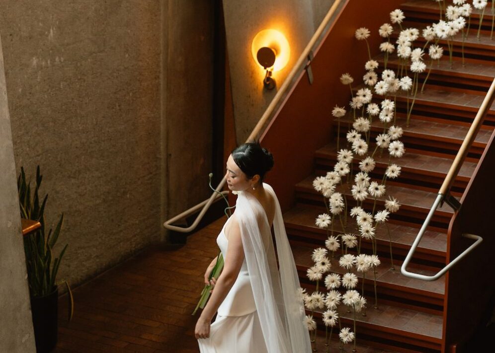 Alder - bride during her wedding standing near a staircase